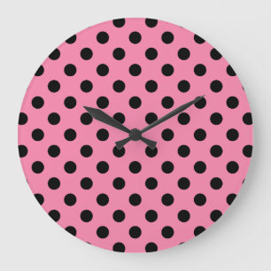 Grote zwarte stippen op hete roze klok
