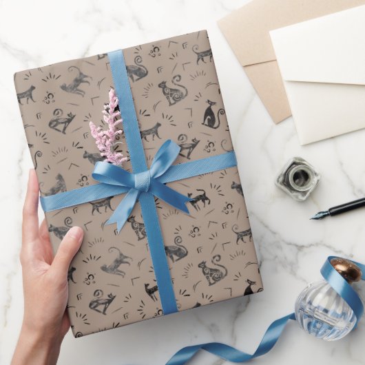 Grottenkatten op lichtbruin cadeaupapier (Geschenken)