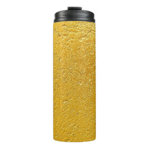 Grunge gouden of folieachtergrond en textureabstra thermosbeker