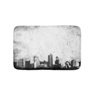 Grungy city background in zwart-wit badmat