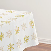 Gulden kerstsnowflakes op wit tafelkleed (Voorbeeld)