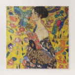 Gustav Klimt Lady met nieuwe Fan Art-indeling Legpuzzel<br><div class="desc">Gustav Klimt Lady met Fan Art Nieuw Schilder Dit halve portret van een mooie vrouw shows een gele achtergrond met aziatische ornamenten, kleurrijke vogels en lotusbloemen. De dame draagt een jurk in de stijl van een kimono, bedrukt met motieven van een Chinese drakenjurk. Mooie artistieke romantische decoratieve kunst. Bekijk meer...</div>