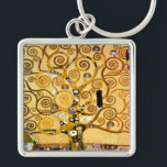 Gustav Klimt Levensboom: Art Nouveau Symbolist Sleutelhanger<br><div class="desc">Verhoog uw ruimte met dit iconische meesterwerk, Gustav Klimt's "Tree of Life" (van de Stoclet Frieze). Dit beroemde art nouveau-kunstwerk boeit met zijn wervelende gouden takken, ingewikkelde patronen en symbolische motieven die de reis, verbinding en groei van het leven vertegenwoordigen. Klimt's kenmerkende gebruik van rijk, glinsterend goud, mozaïekachtige details en...</div>