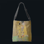Gustav Klimt The Kiss Crossbody Tas<br><div class="desc">De Kus is het meest iconische en beroemde schilderij van Gustav Klimt. Het is een prachtig gouden schilderij van een paar diep verliefd op het delen van een romantisch moment van een gepassioneerde kus. Profiteer van uw hoogwaardige cadeauideeën en geweldige producten met dit prachtige meesterwerk. Bekijk onze winkel voor meer...</div>