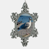 Haargull op een houten omheining tin sneeuwvlok ornament (Links)