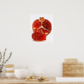 Half a ripe pomegranate cut to expose the juicy poster (Keuken)