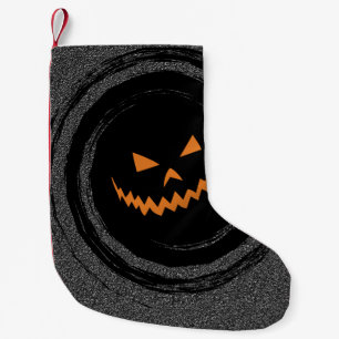 Halloween Gloeiende Jack O'Lantern in een zwarte Kleine Kerstsok