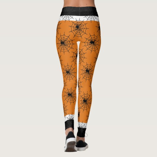 Halloween spinnenweb zwart en sinaasappel leggings (Achterkant)