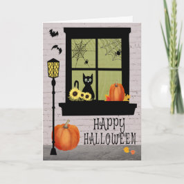 Halloween-venster met zwarte kat en pompoenen kaart