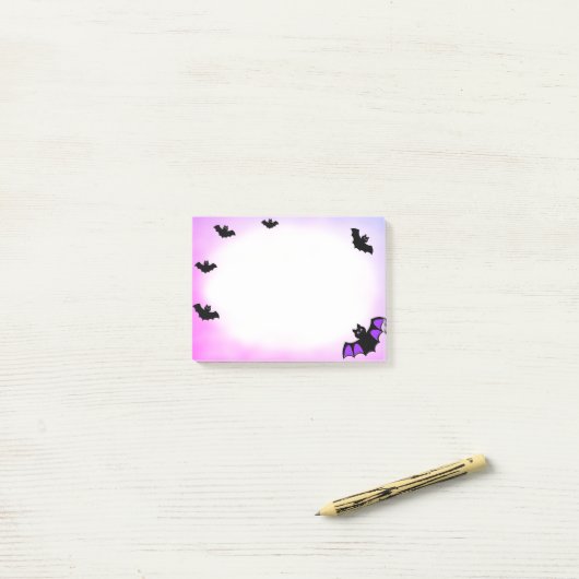 Halloween vliegende vleermuizen op paars en wit post-it® notes (Op bureau)