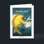 Hamlet Verjaardag Kaart<br><div class="desc">Het afbeelding van de kaart is van een goudkleurig gehucht met een visschedel die Shakespeares Hamlet nabootst. Binnentekst: "Je bent nog een jaar ouder" Op de achterkant van de kaart staan leuke weetjes over de gehuchten en Shakespeare's Hamlet.</div>
