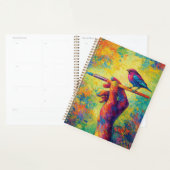 Hand die een penseel vasthoudt met vogel creatief planner (Display)