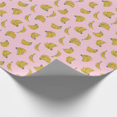 Hand getrokken schattig banaan patroon in roze ach cadeaupapier (Hoek)