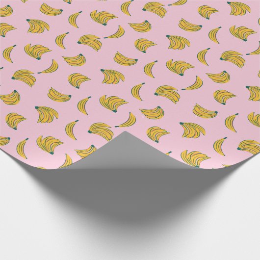 Hand getrokken schattig banaan patroon in roze ach cadeaupapier (Hoek)
