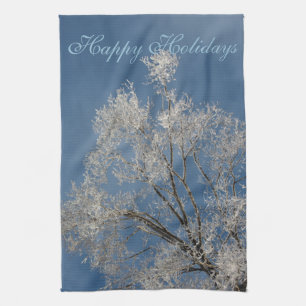 Handdoeken met sneeuw bedekte takken