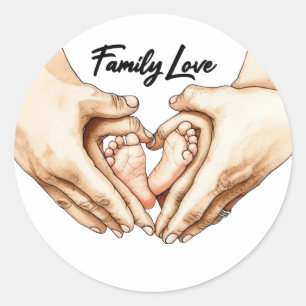 Handen die babyvoetjes vasthouden ronde sticker