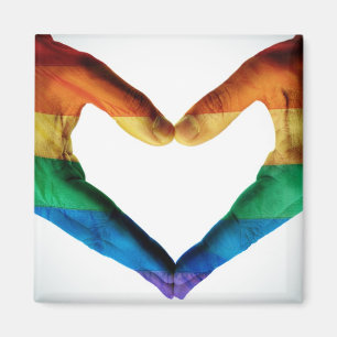 Handen schilderd als regenbooghart magneet