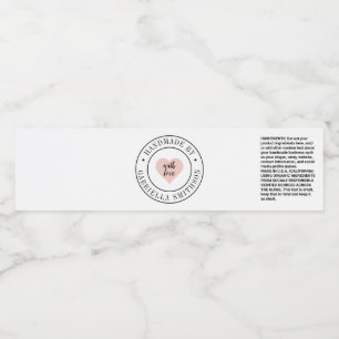 Handgemaakte productverpakking rond label Roze har Waterfles Etiket