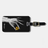 Handje dat een radiatiesymbool vasthoudt bagagelabel (Voorkant horizontaal)