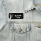 Handje dat een radiatiesymbool vasthoudt naamplaatje (In situ)