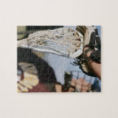 Handje op een Lacrosse Stick Legpuzzel (Horizontaal)
