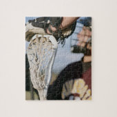 Handje op een Lacrosse Stick Legpuzzel (Verticaal)