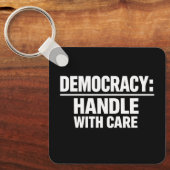 Handle Democracy With Care Sleutelhanger (Voorkant)
