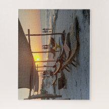 Hangmatten bij de zee bij zonsondergang