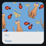 Hanukkah Cat Dreidel Blue Gift Label Sticker<br><div class="desc">Kattenliefhebbers zullen blij zijn met deze leuke, griezelige 'Hanukkat' label sticker met een oranje bruine, nieuwsgierige kat met een kippah, rode droidels en gele menorahs/channukiahs op een heldere blauwe achtergrond. Ideaal voor het verpakken van je geschenken uit Hannukah / Chanoeka tijdens het joodse festival van Lichten! Pas de tekst aan...</div>