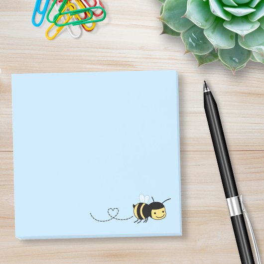 Happy Bee die ronddraait op blauw Post-it® Notes