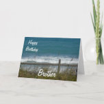 Happy Birthday Brother-Ocean Waves Kaart<br><div class="desc">Dit is een mooie kaart voor de verjaardag van je broer, met een uitzicht van de blauwe oceaangolven, gezien door een hek met strandgras dat in de wind zwaait. Inside is een mooi versum van mij, dat u natuurlijk kunt aanpassen/personaliseren om aan uw behoeften tegemoet te komen! Je kunt het...</div>