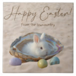 Happy Easter Lowcountry Oyster Shell and Bunny Tegeltje<br><div class="desc">Happy Easter Lowcountry style! The design on this beautiful Lowcountry Easter ceramic tile features an oyster shell in the sand with a white bunny rabbit and three pastel colored Easter eggs. The text reads "Happy Easter from the Lowcountry." The decorative tile/trivet is perfect for Easter brunch or holiday gatherings with...</div>