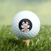 Happy penguin holding a sign to personalize golfballen (Insitu Shirt)