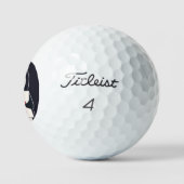 Happy penguin holding a sign to personalize golfballen (Logo)