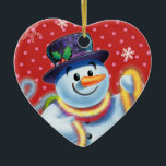 Hart Kerstboom decoratie Snowman & tinsel.<br><div class="desc">Hartvorm roze kerstboom decoratie Snowman en klatergoud.pinks. Deze vrolijke sneeuwman staat op het punt zijn boom te versieren met kleurrijk klatergoud. Bekijk de andere personages in deze zelfde serie,  Santa en Polar Beer en Rudolph.</div>