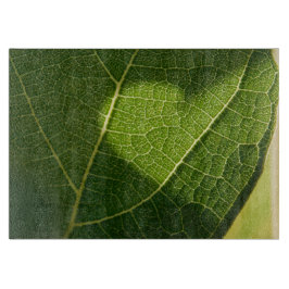 Hart op een zonovergoten blad glazen dienblad snijplank