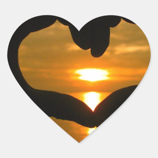 Hart van de hand over zonsondergang sticker (Voorkant)