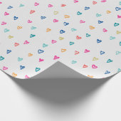 Hartelijk gekleurde liefdesharten op witte achterg cadeaupapier (Hoek)