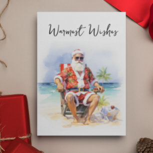Hartelijke groeten Kerstman op het strand Feestdagenkaart
