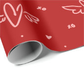 Harten en vleugels op rood cadeaupapier (Rol Hoek)