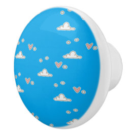 Harten en wolken op blauw keramische knop