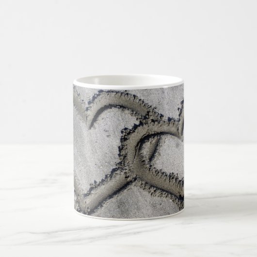 Harten verbonden in het zand koffiemok (Center)