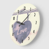 Hartvormig liefdespaasspel bevestigd aan een helli grote klok (Hoek)