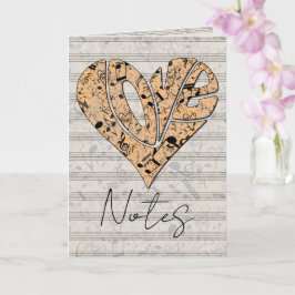 Hartvormige liefdestypografie met muzieknoten kaart