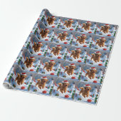 Havanese hardloop in de sneeuw met kerstmuts cadeaupapier (Uitgerold)