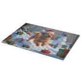 Havanese hardloop in de sneeuw met kerstmuts snijplank (Hoek)