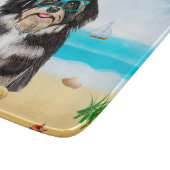 Havanese hond op het strand snijplank (Hoek)