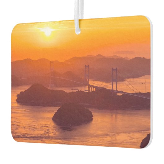 Hazy sunset on Kurushima Kaikyo Bridge and Kurushi Luchtverfrisser (Links)