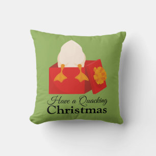Heb een kwakzalvende kerst schattige eend in rode kussen