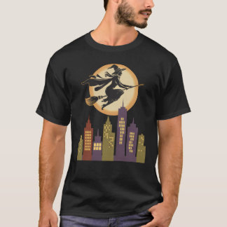 Heks vliegt over een retro stadsgezicht t-shirt